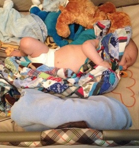 Baby Bas snuggled up to his patchwork memory blanket I made him. I enjoyed making this for him and I enjoy even more watching him enjoy it. 